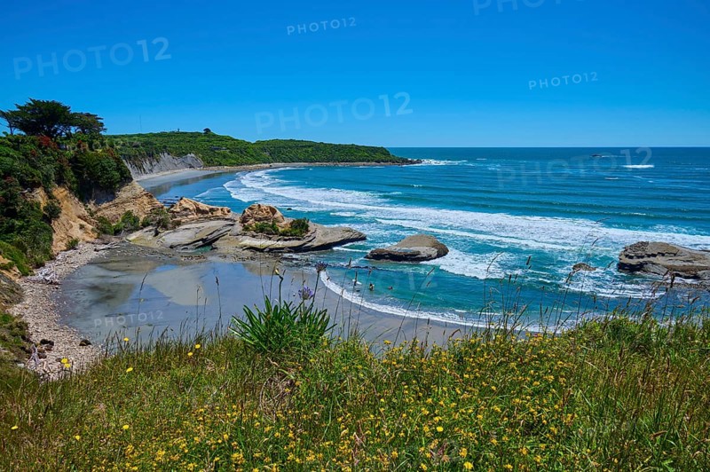 Coastal landscape with waves, rocks and blue sky, Cape Foulwind, West Coast, South Island, New Zealand