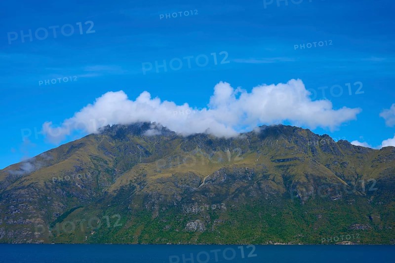 Majestic mountains with clouds against a clear blue sky, Devil's Staircase Lookout Point, Kingston, Lake Wakatipu, Queenstown-Lakes District, Otago, South Island, New Zealand