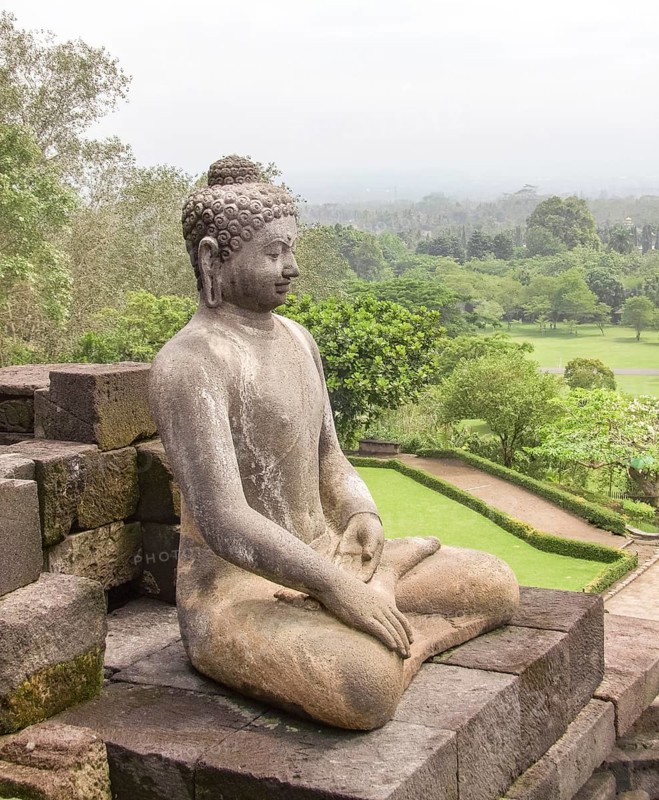 Buddha sculpture at a temple named Borobudur located in Java, a island of Indonesia