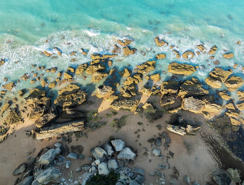 The Roche coves at he Mediterranean Sea. Aerial view. Drone shot. Cádiz province, Andalusia, Spain