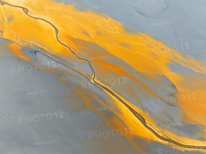 Abstract patterns in a waste pond in the mineral-rich area of the Rio Tinto mines. The colour is caused by oxidised iron minerals. Aerial view. Drone shot. Huelva province, Andalusia, Spain