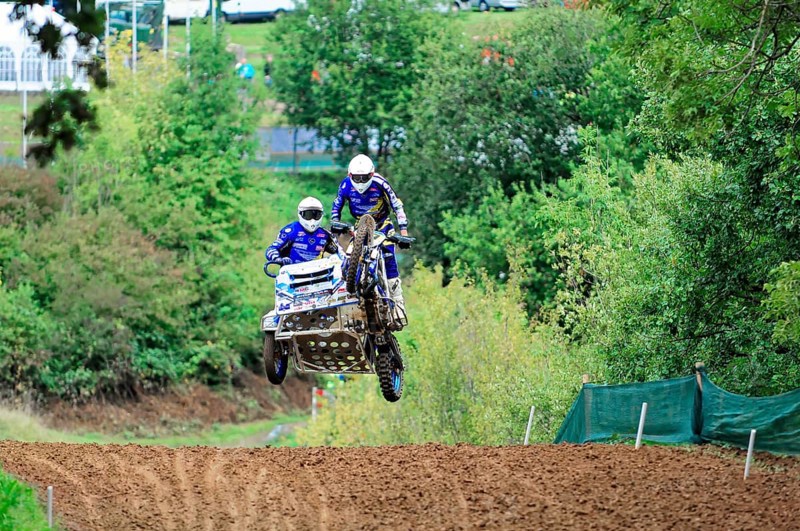 Motocross, Rudersberg, Baden-Württemberg, Germany, Europe, Two riders jump through the air over a track with their sidecar motorbike, Rudersberg Motocross