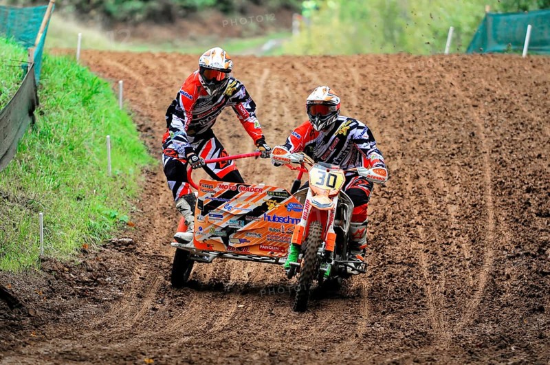 Motocross, Rudersberg, Baden-Württemberg, Germany, Europe, Sidecar motorbike riders ride through a muddy bend at high speed in a competition, Rudersberg motocross