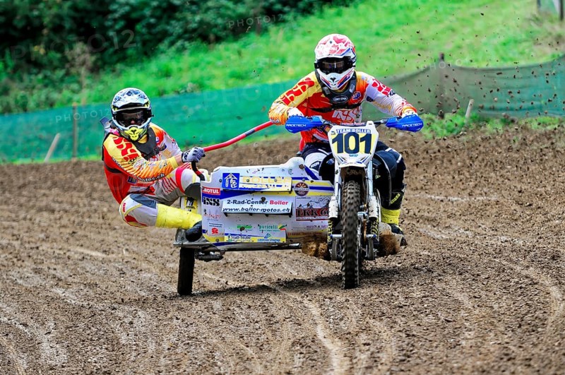 Motocross, Rudersberg, Baden-Württemberg, Germany, Europe, Rider with sidecar races through muddy track, Mud splashes in the air, Rudersberg motocross