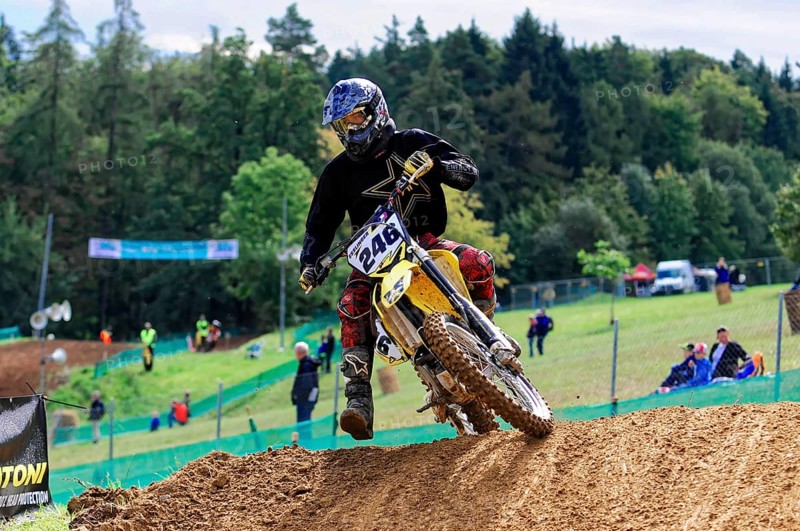 Motocross, Rudersberg, Baden-Württemberg, Germany, Europe, Rider on motorbike in fast ride on earth, surrounded by trees and spectators, Rudersberg Motocross
