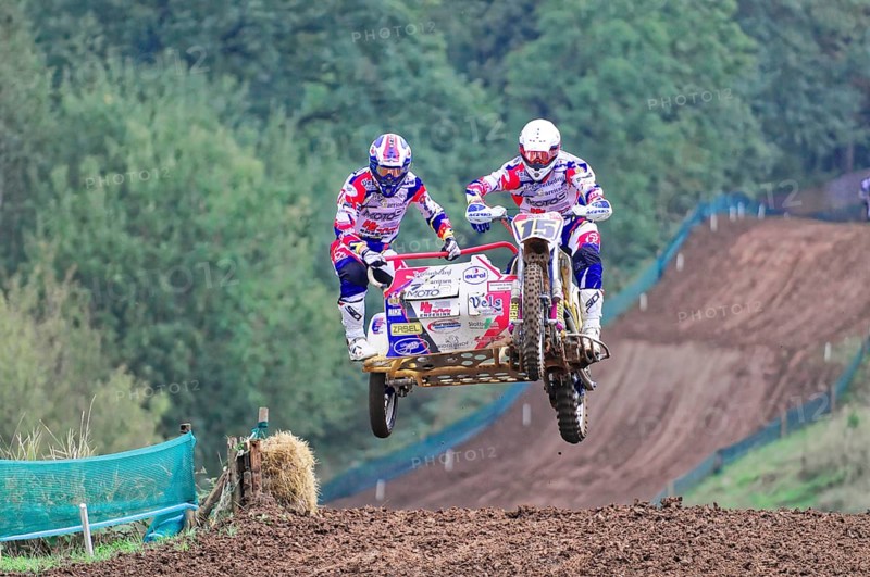 Motocross, Rudersberg, Baden-Württemberg, Germany, Europe, Two motocross riders with sidecars jump into the air on a muddy track, Rudersberg motocross
