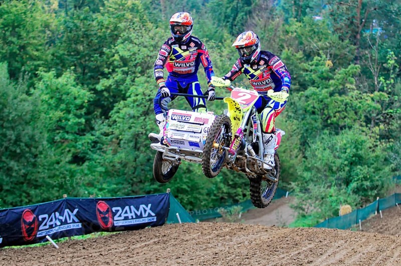 Motocross, Rudersberg, Baden-Württemberg, Germany, Europe, Two riders on a sidecar motorbike jump over a mound of earth on a race track in the forest, Rudersberg Motocross