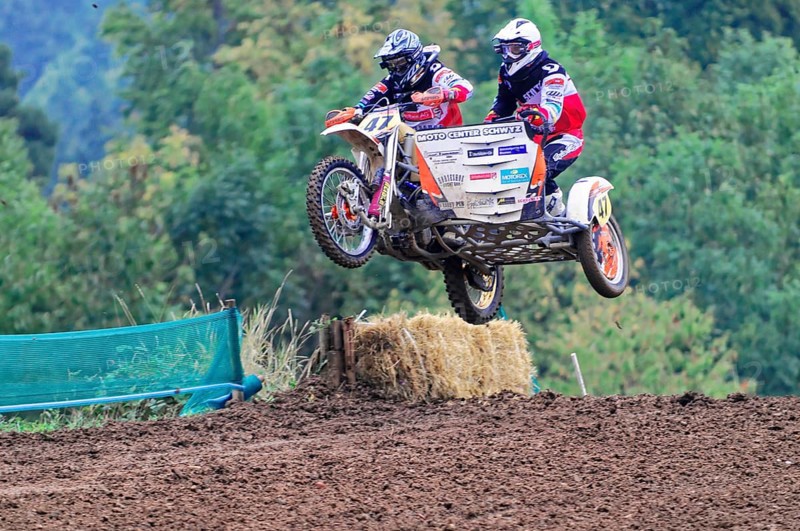 Motocross, Rudersberg, Baden-Württemberg, Germany, Europe, Motocross team takes a leap with sidecar at a race in the countryside, Rudersberg motocross