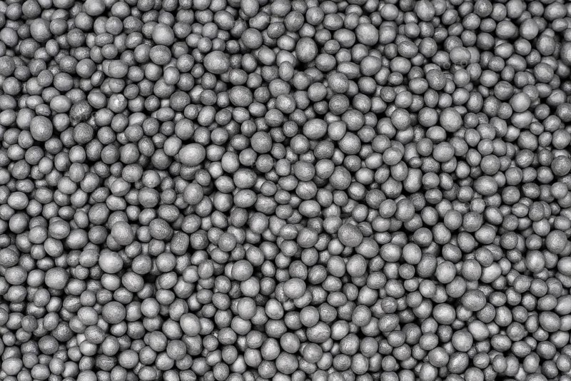 Full frame closeup showing lots of dark polystyrene beadlets