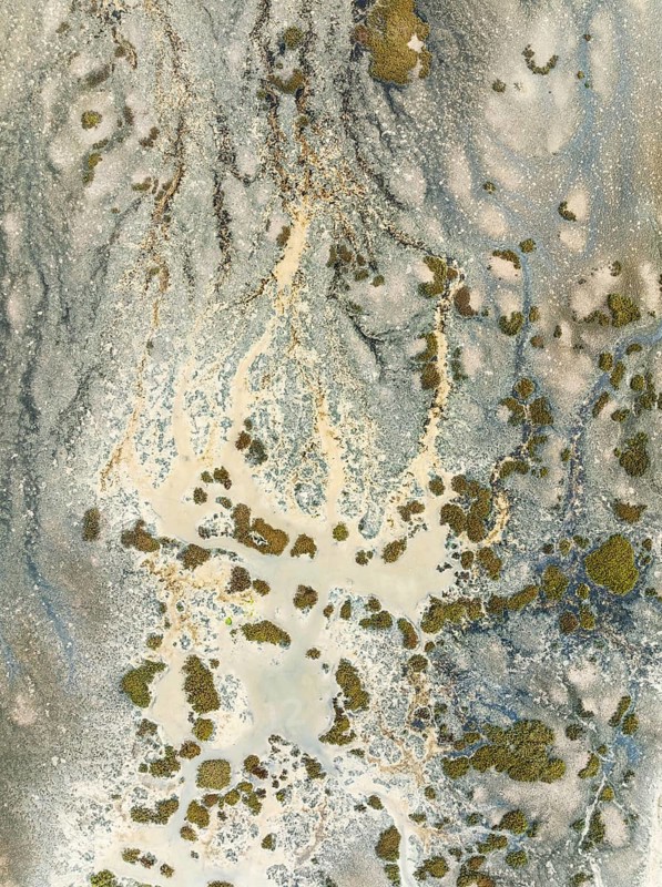 Marshland at low tide. Nature Reserve La Breña y Marismas del Barbate. Aerial view. Drone shot. Cádiz province, Andalusia, Spain