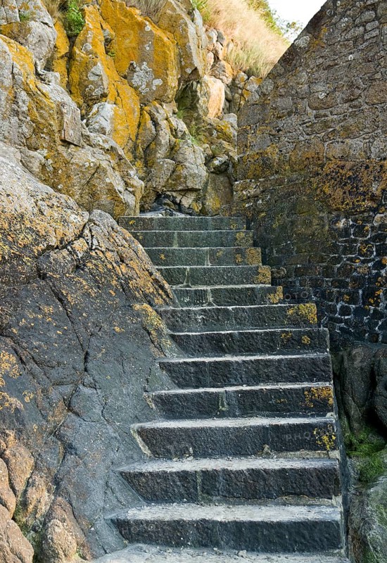 Stairs around the Mont Saint Michel Abbey in Lower Normandy France at evening time