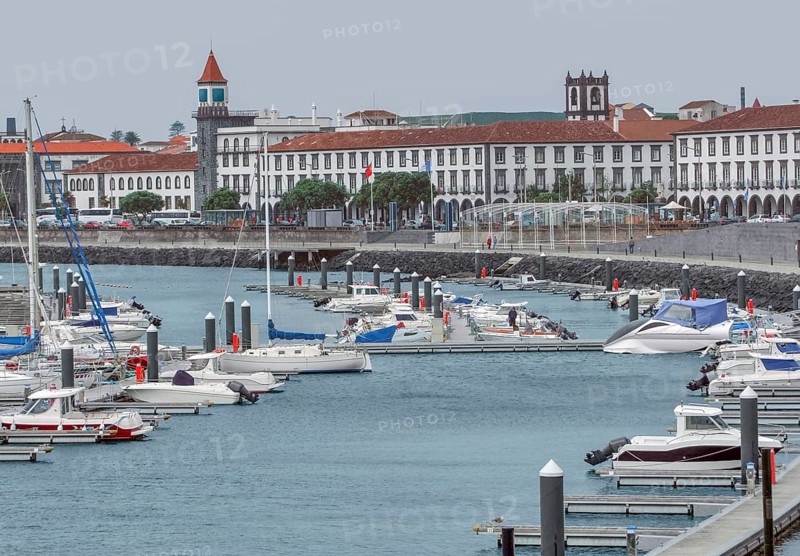 City view with harbor at Ponta Delgada, capital city of the Azores at Sao Miguel Island, the biggest island of the Azores Archipelago, wich is a group of vulcanic islands located in the middle of the North Atlantic Ocean Portugal