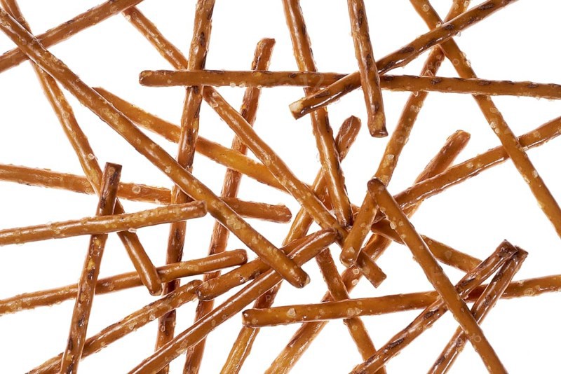 Closeup of some crossed salt sticks in white back