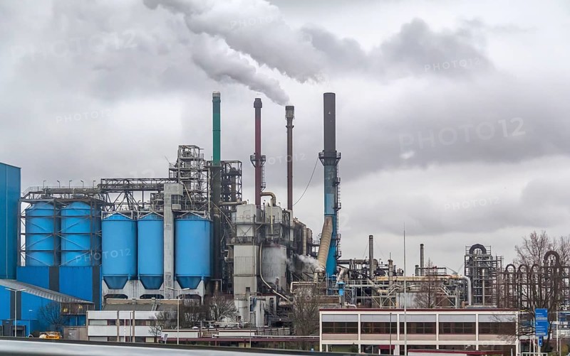 Industrial roadside scenery including a fabric and refinery