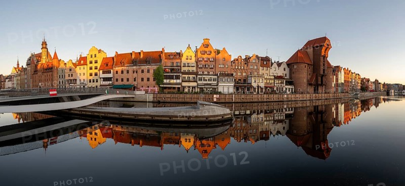 Panorama of the waterfront promenade with reflection at sunrise in the Old Town, Motlawa River, Gdansk, Gdansk, Poland