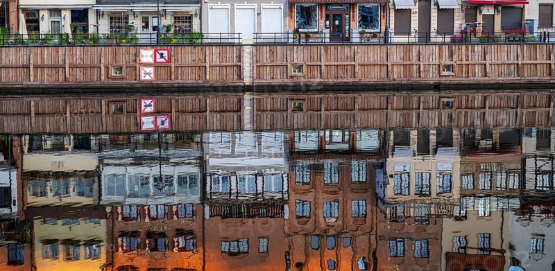 Waterfront promenade with reflection at sunrise in the Old Town, Motlawa River, Gdansk, Gdansk, Poland