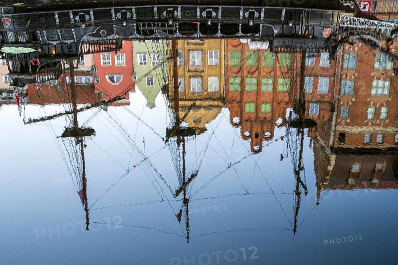 Waterfront promenade with reflection at sunrise in the Old Town, Motlawa River, Gdansk, Gdansk, Poland