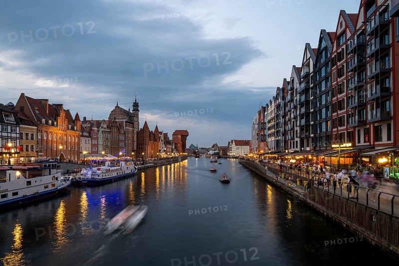 Illuminated promenade at sunset in the Old Town, Motlawa River, Gdansk, Poland