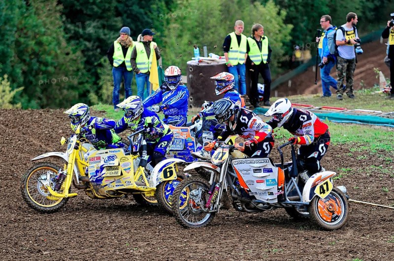 Motocross, Rudersberg, Baden-Württemberg, Germany, Europe, Several motocross riders in colourful gear prepare for the start of a race, Rudersberg motocross