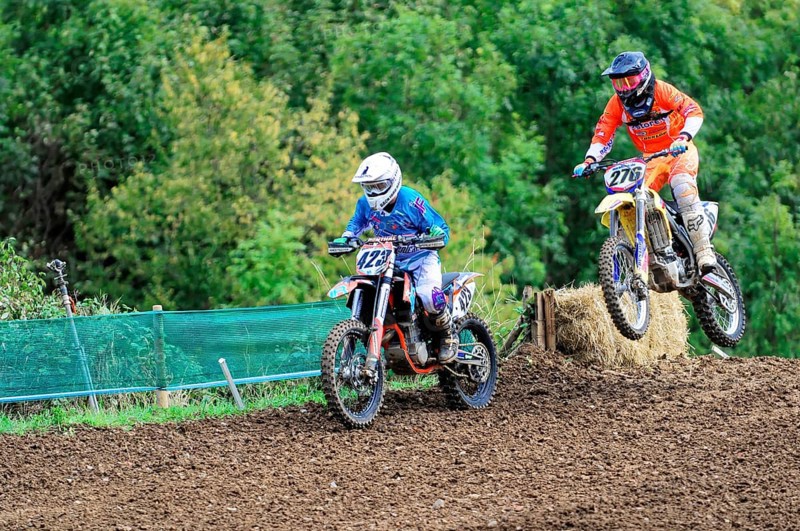 Motocross, Rudersberg, Baden-Württemberg, Germany, Europe, Two motocross riders during a jump over a ramp in a rural area, Rudersberg motocross