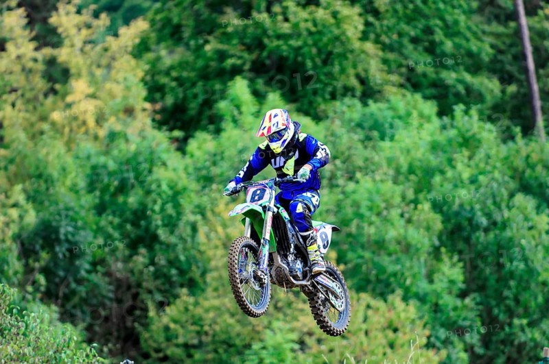 Motocross, Rudersberg, Baden-Württemberg, Germany, Europe, A motocross rider lifts off the ground on his motorbike and flies over a natural track, Rudersberg motocross