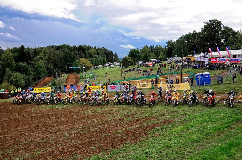 Motocross, Rudersberg, Baden-Württemberg, Germany, Europe, Riders stand side by side at the starting line of a race, with numerous spectators in the background, Rudersberg Motocross
