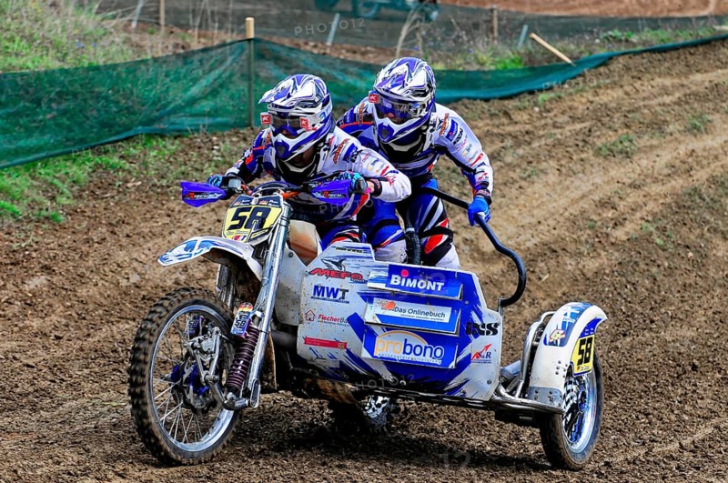 Motocross, Rudersberg, Baden-Württemberg, Germany, Europe, Two riders travelling fast over a muddy race track with sidecars, Rudersberg motocross