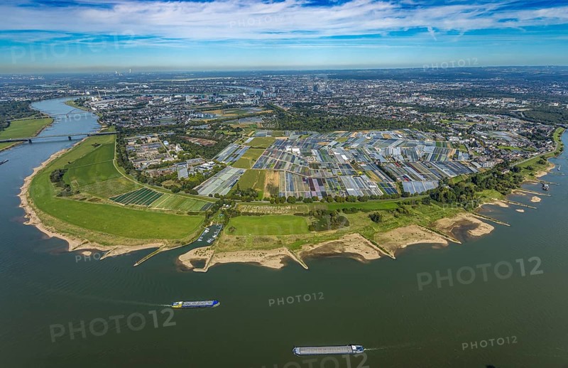 Aerial view, Rhine bend and district Volmerswerth, horticultural farms and agricultural use in the district Volmerswerth, shapes and colours with graphical representation, river Rhine and inland navigation, distant view and blue sky with clouds, Volmerswerth, Düsseldorf, Ruhr area, North Rhine-Westphalia, Germany, DE, Europe, river, aerial view, aerial photography, aerial photography, navigation, overview, bird's-eye view, overview