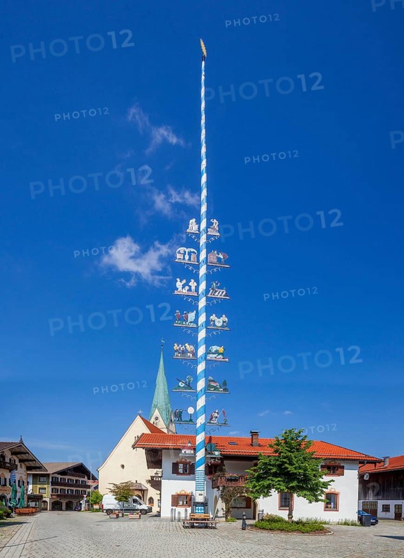 Parish Church of the Assumption of the Virgin Mary with maypole and town hall on the village square, Törwang, Samerberg, Chiemgau, Upper Bavaria, Bavaria, Germany