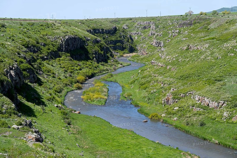 A river meanders through a green gorge under a blue sky, Achuryan River, Akhuryan, near Jradzor, Shirak Province, Armenia