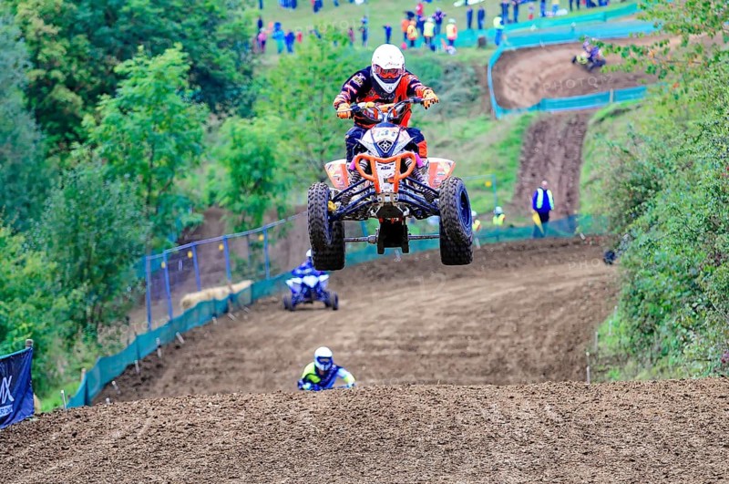 Motocross, Rudersberg, Baden-Württemberg, Germany, Europe, A quad bike rider jumps over a track elevation while other riders can be seen behind, Rudersberg Motocross