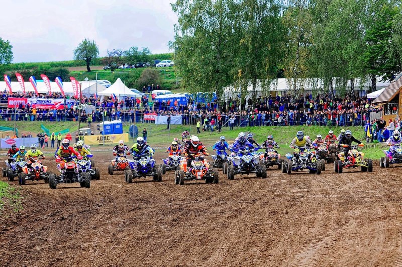 Motocross, Rudersberg, Baden-Württemberg, Germany, Europe, Several quad bikers start a race, watched by spectators behind a row of tents, Rudersberg motocross