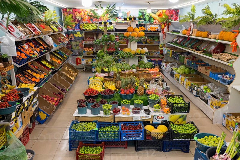 A well-stocked shop full of colourful fruit and vegetables displayed on shelves and tables, Gyumri, Gyumri, Gyumri, Shirak Province, Armenia