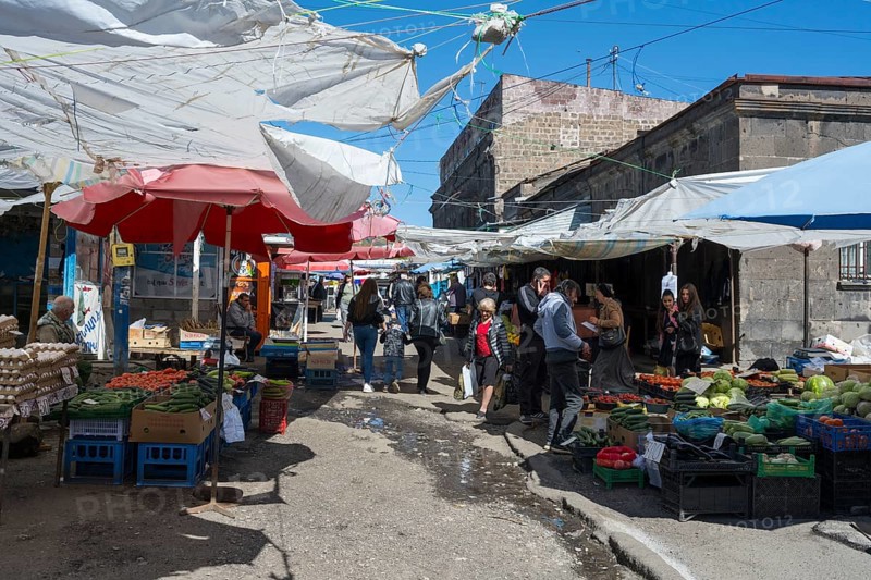 Lively outdoor market with many stalls and people under awnings, Gyumri, Giumri, Gyumri, Shirak province, Armenia