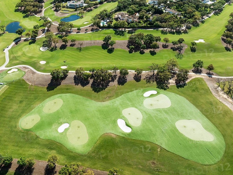 Driving range with greens and bunkers at the San Roque Club Golf Resort. Aerial view. Drone shot. Cádiz province, Andalusia, Spain
