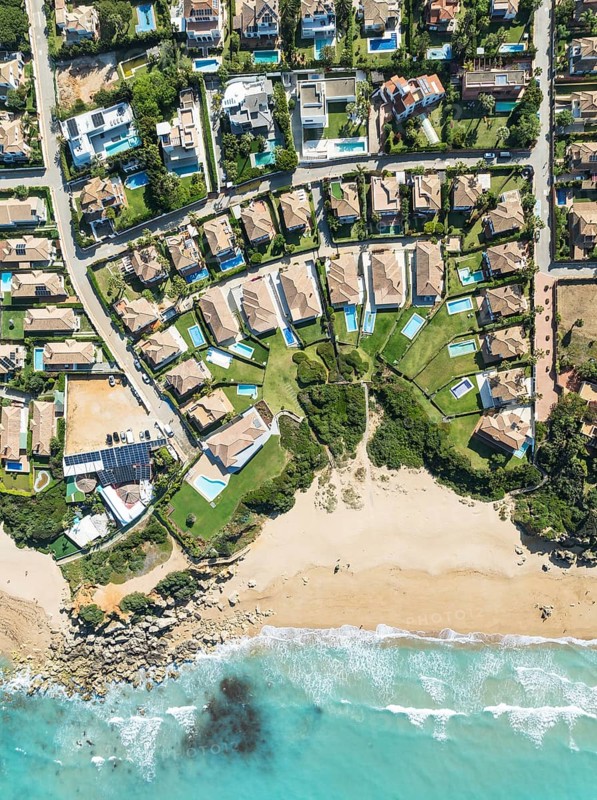 The Roche housing estate at the Mediterranean Sea. Aerial view. Drone shot. Cádiz province, Andalusia, Spain