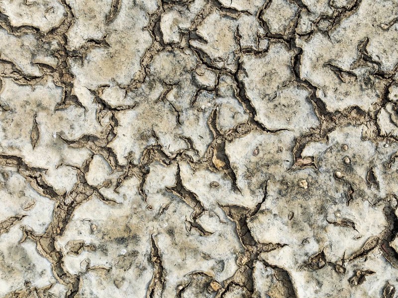 Dried mud in the marshland of the Bahía de Cádiz Nature Reserve. Aerial view. Drone shot. Cádiz province, Andalusia, Spain