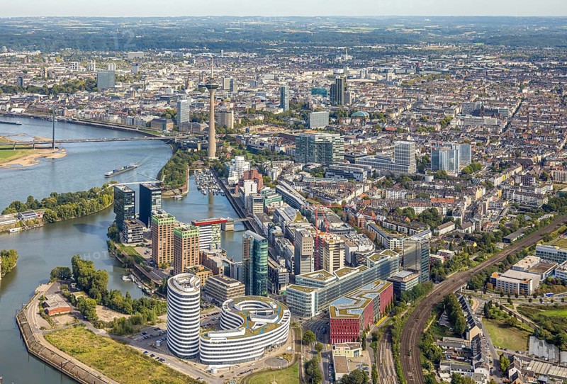 Aerial view, Media Harbour at the river Rhine, Rhine Tower and Rheinknie Bridge, in front construction site with construction crane and new Uniq Towers between Kaistraße and Zollhof, view over Düsseldorf City with Old Town, harbour, Düsseldorf, Ruhr area, North Rhine-Westphalia, Germany, Old Town, construction work, construction area, construction site, building plots, construction, construction project, construction site, bridge, DE, Europe, commercial enterprise, commercial space, commercial area, commercial property, commercial location, commercial use, industrial area, industrial location, aerial view, aerial photography, aerial photography, new building, tower, overview, bird's eye view, birds-eyes view, overview
