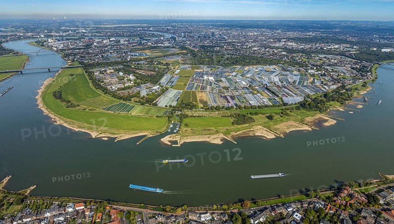 Aerial view, Rhine bend and district Volmerswerth, horticultural farms and agricultural use in the district Volmerswerth, shapes and colours with graphical representation, river Rhine and inland navigation, distant view and blue sky with clouds, Volmerswerth, Düsseldorf, Ruhr area, North Rhine-Westphalia, Germany, DE, Europe, river, aerial view, aerial photography, aerial photography, navigation, overview, bird's-eye view, overview