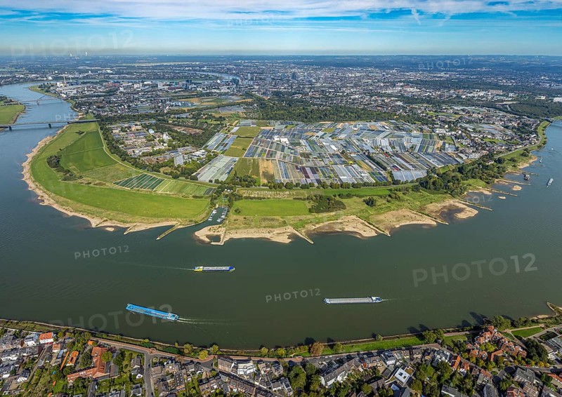 Aerial view, Rhine bend and district Volmerswerth, horticultural farms and agricultural use in the district Volmerswerth, shapes and colours with graphical representation, river Rhine and inland navigation, distant view and blue sky with clouds, Volmerswerth, Düsseldorf, Ruhr area, North Rhine-Westphalia, Germany, DE, Europe, river, aerial view, aerial photography, aerial photography, navigation, overview, bird's-eye view, overview