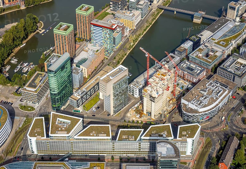 Aerial view, Media harbour on the river Rhine, construction site with construction crane and new Uniq Towers between Kaistraße and Zollhof, harbour, Düsseldorf, Ruhr area, North Rhine-Westphalia, Germany, construction work, construction area, construction site, building plots, construction crane, construction project, construction site, DE, Europe, commercial enterprise, commercial space, commercial area, commercial property, commercial site, commercial use, industrial area, industrial site, aerial view, aerial photography, aerial photography, media centre, new building, overview, bird's-eye view, overview