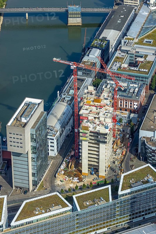 Aerial view, Media harbour on the river Rhine, construction site with construction crane and new Uniq Towers between Kaistraße and Zollhof, harbour, Düsseldorf, Ruhr area, North Rhine-Westphalia, Germany, construction work, construction area, construction site, building plots, construction crane, construction project, construction site, DE, Europe, commercial enterprise, commercial space, commercial area, commercial property, commercial site, commercial use, industrial area, industrial site, aerial view, aerial photography, aerial photography, media centre, new building, overview, bird's-eye view, overview