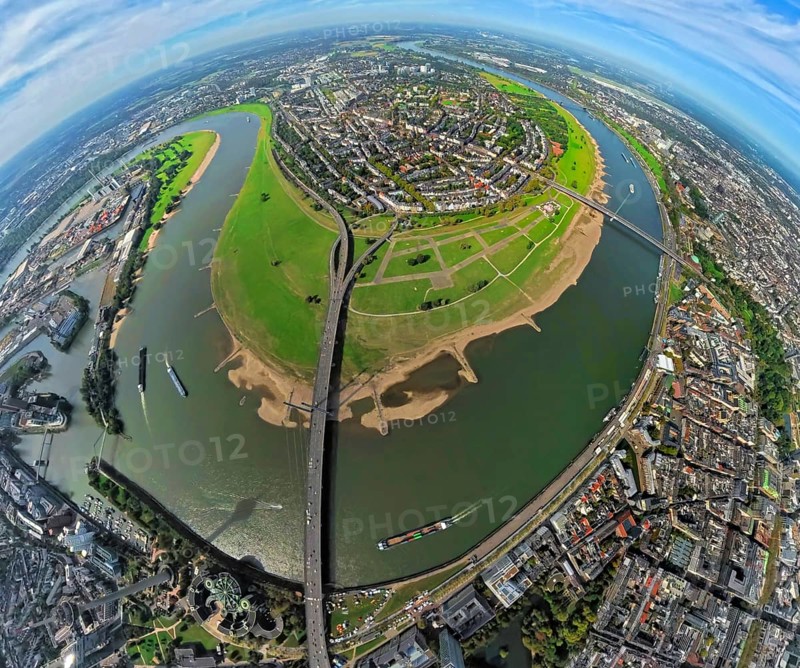 Aerial view, district Oberkassel with Festwiese Oberkassel, Rheinkniebrücke and Oberkasseler Brücke over the river Rhine, globe, fisheye image, fisheye image, 360 degree image, tiny world, little planet, fisheye image, Oberkassel, Düsseldorf, Ruhr area, North Rhine-Westphalia, Germany, bridge, DE, Europe, fisheye lens, fisheye lens, river, little planet, aerial photography, aerial photography, aerial photography, super wide angle lens, tiny world, overview, bird's eye view, globe, birds-eyes view, fisheye lens, insta360 camera, overview