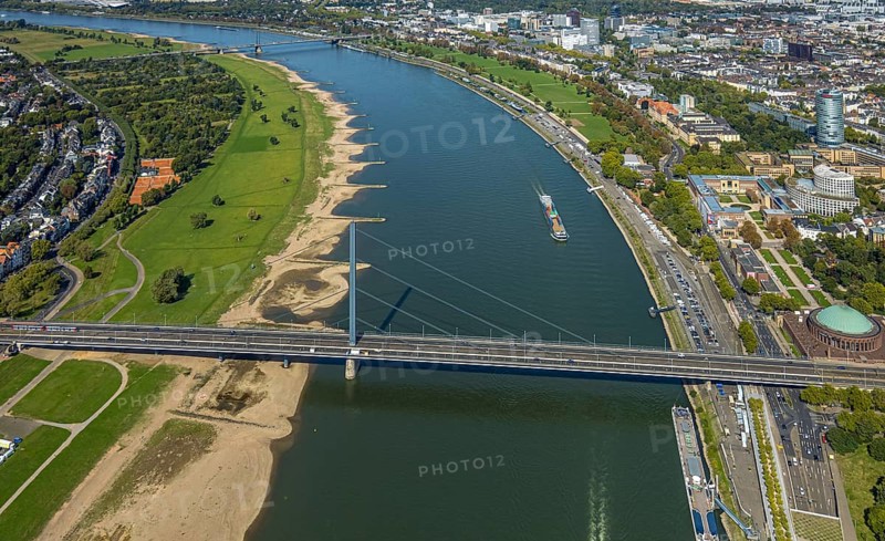 Aerial view, Oberkasseler Brücke over the river Rhine and Tonhalle Düsseldorf, Rhine promenade, North Rhine-Westphalia-Forum Düsseldorf and Kunstpalast Düsseldorf Ehrenhof, district government and round high-rise building ERGO Group AG, Pempelfort, Düsseldorf, Ruhr area, North Rhine-Westphalia, Germany, bridge, DE, Europe, events, river, culture, art, aerial view, aerial photography, aerial photography, theatre, overview, event hall, event venue, event centre, bird's-eye view, birds-eyes view, cultural use, overview
