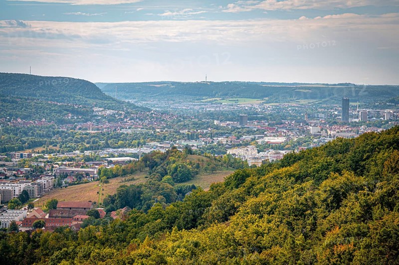 View of the city of Jena and mountains in the background from a wooded hill, Jena, Thuringia, Germany