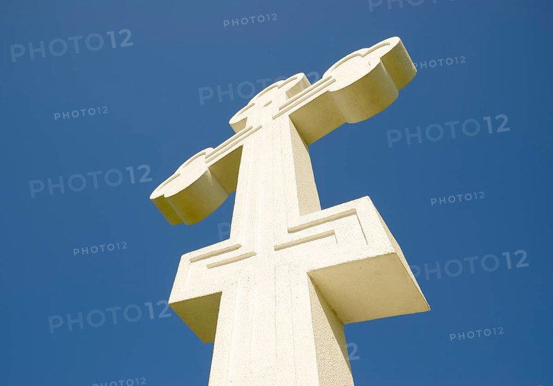 White orthodox christian cross on blue sky background. Krasnodar, Russia