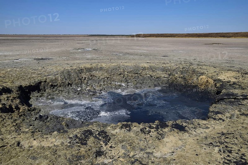 Source vents mud at the bottom of a dried-up salt lake. Taman, Krasnodar Krai, Russia