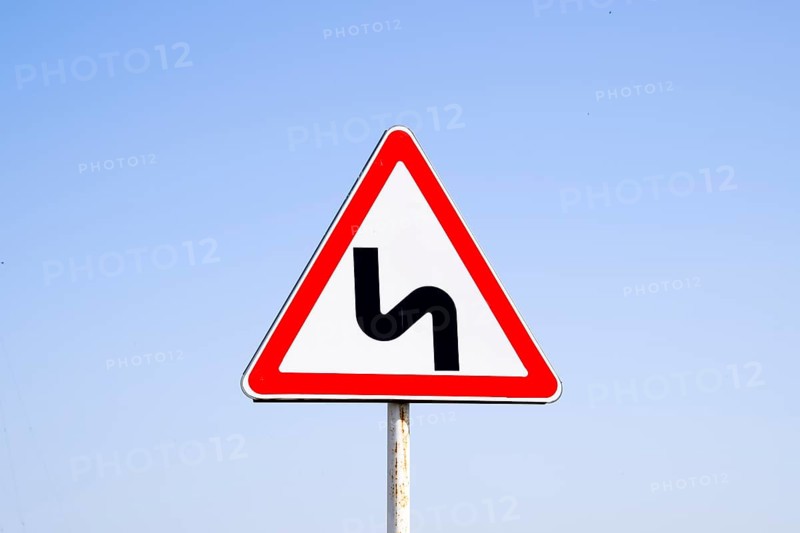 Road sign dangerous turn. Krasnodar, Russia