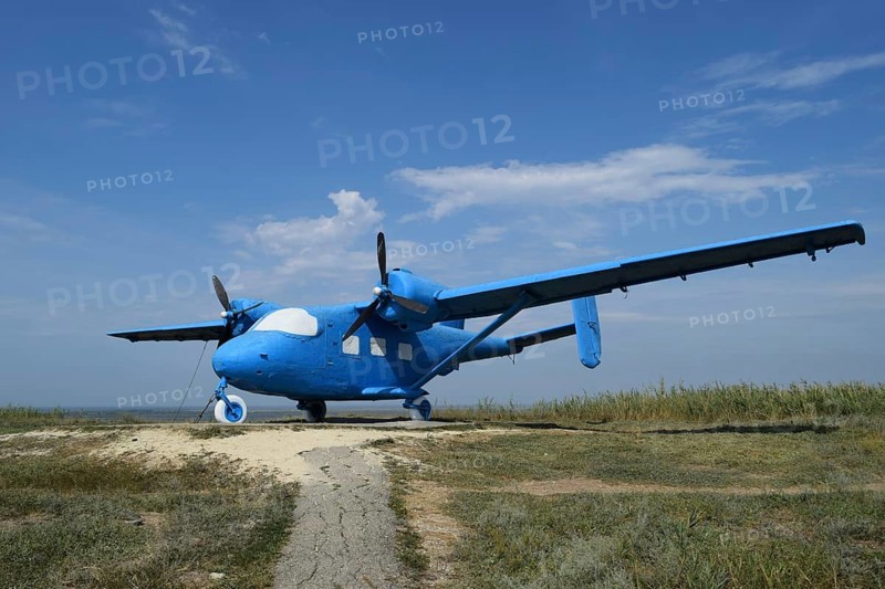 Blue rotary-wing aircraft on the hill. Taman, Krasnodar Krai, Russia