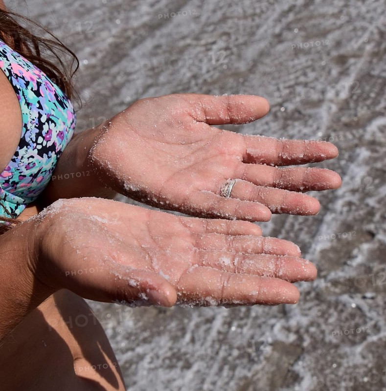 Salt on the girl's hands. Taman, Krasnodar Krai, Russia